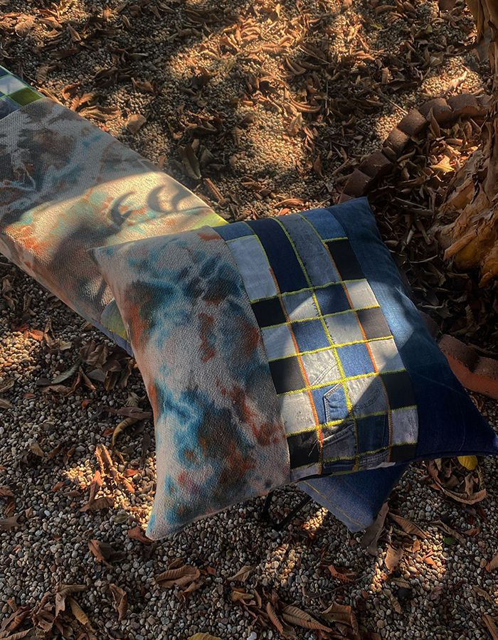 Bench and pillow made from reclaimed denim and jeans, paint, and tie-dyed terry loop textile by Dye Lit Goods, 2020