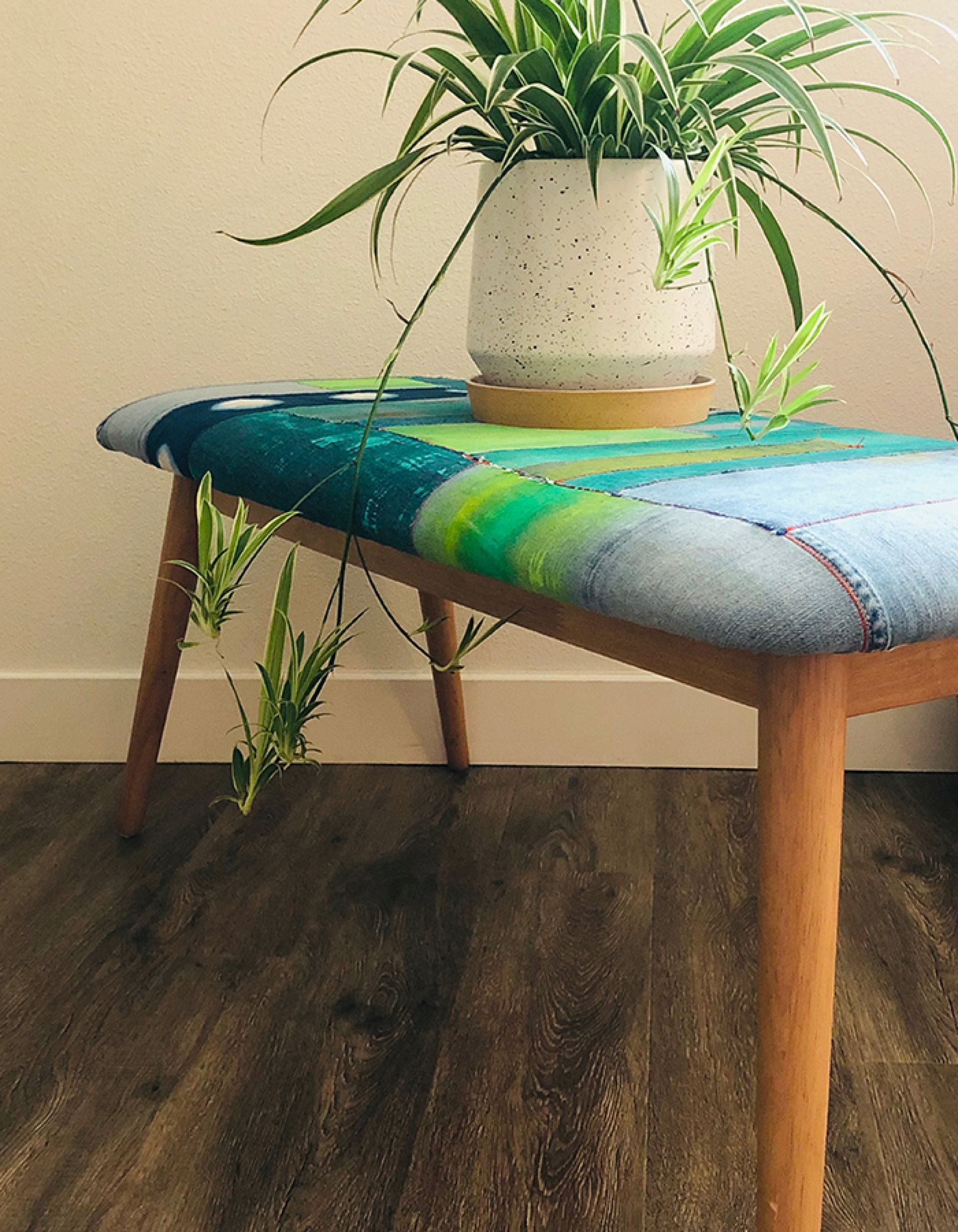 Reupholstered bench using painted denim and reclaimed jean scraps, 2020